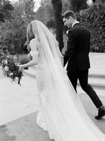 Full-length view of the Talitha modern long wedding veil in cathedral length on a bride.