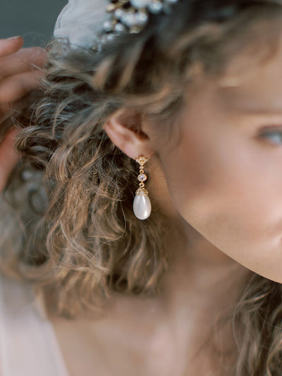An image of a model showcasing the Bridal Earrings collection, including drop earrings and long dangle earrings for the romantic bride.