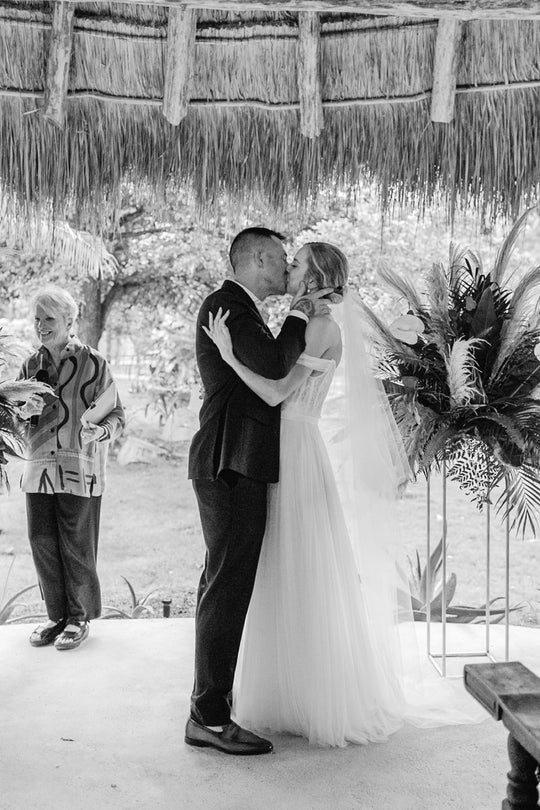 Bride wearing the ARIA sheer wedding veil with blusher with an off-the-shoulder wedding dress.