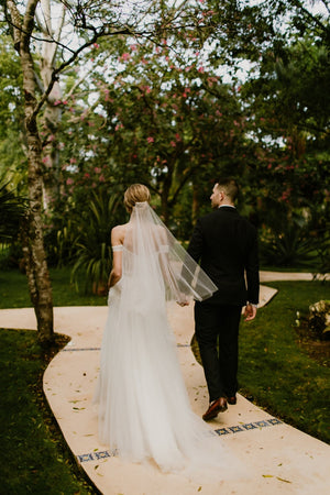 Bride wearing the ARIA sheer wedding veil with blusher with an off-the-shoulder wedding dress.
