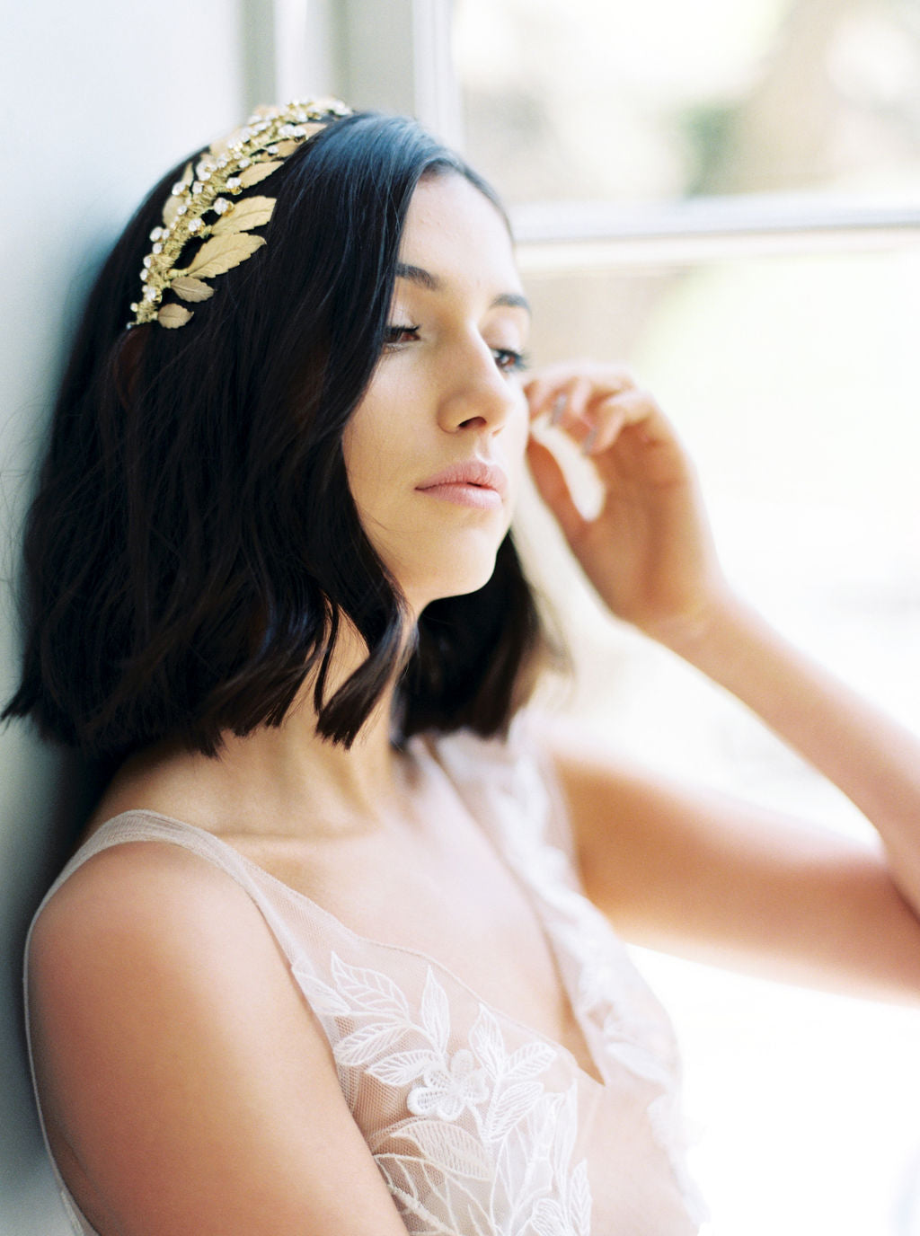 Gold wedding headpiece with crystals.