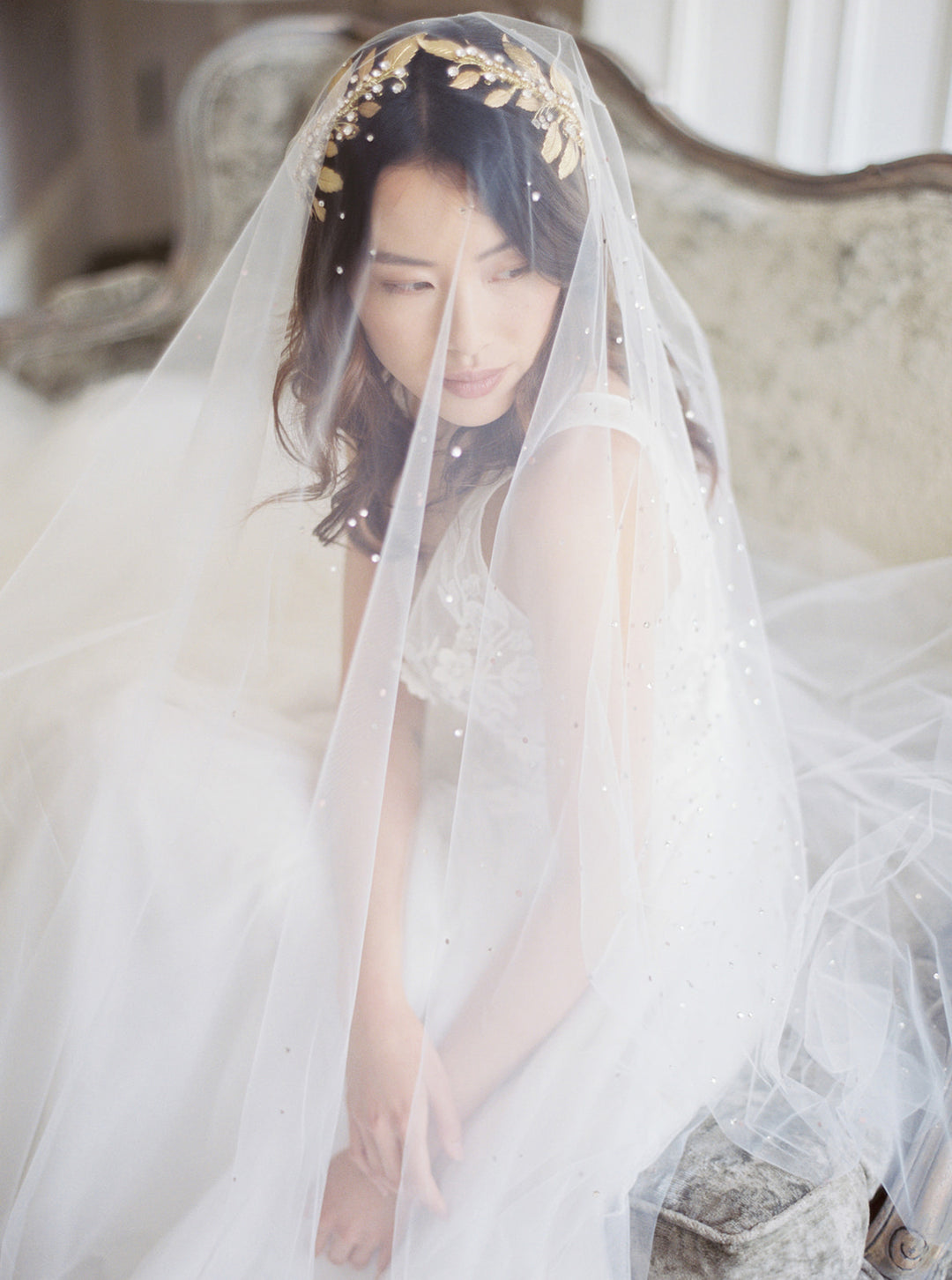 Gold wedding headpiece with crystals.