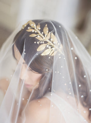 Gold wedding headpiece with crystals.