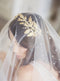 Gold wedding headpiece with crystals.