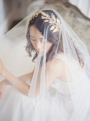 Gold wedding headpiece with crystals.