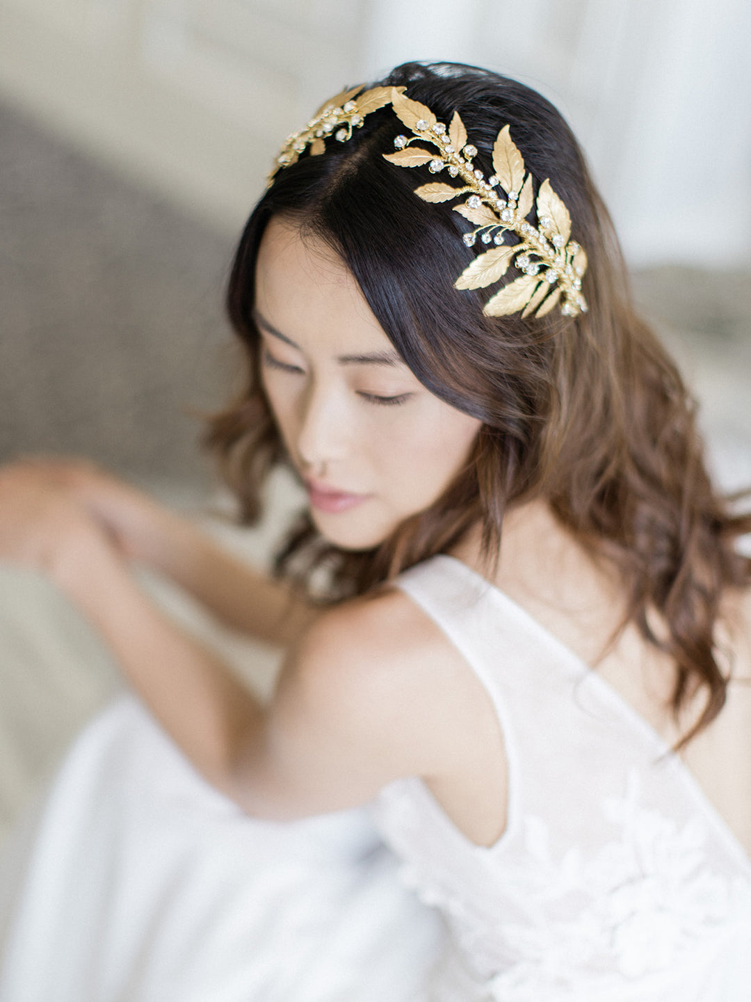 Gold wedding headpiece with crystals.