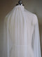 The Isabelle silk wedding veil shown on a dress mannequin, with the veil draped over the shoulders to showcase the softness of the tulle.