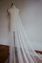 A side shot of the Isabelle silk veil, showing the light gathering at the comb and the soft, flowy nature of the tulle.