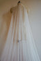 Close up view of the Isabelle silk veil, showing the delicate gathering at the comb.