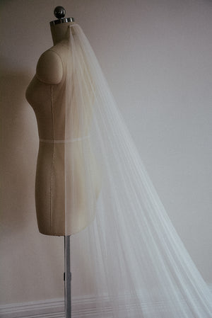 A profile photo of the Isabelle silk wedding veil, showing the soft drape of the tulle.
