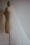 A profile photo of the Isabelle silk wedding veil, showing the soft drape of the tulle.