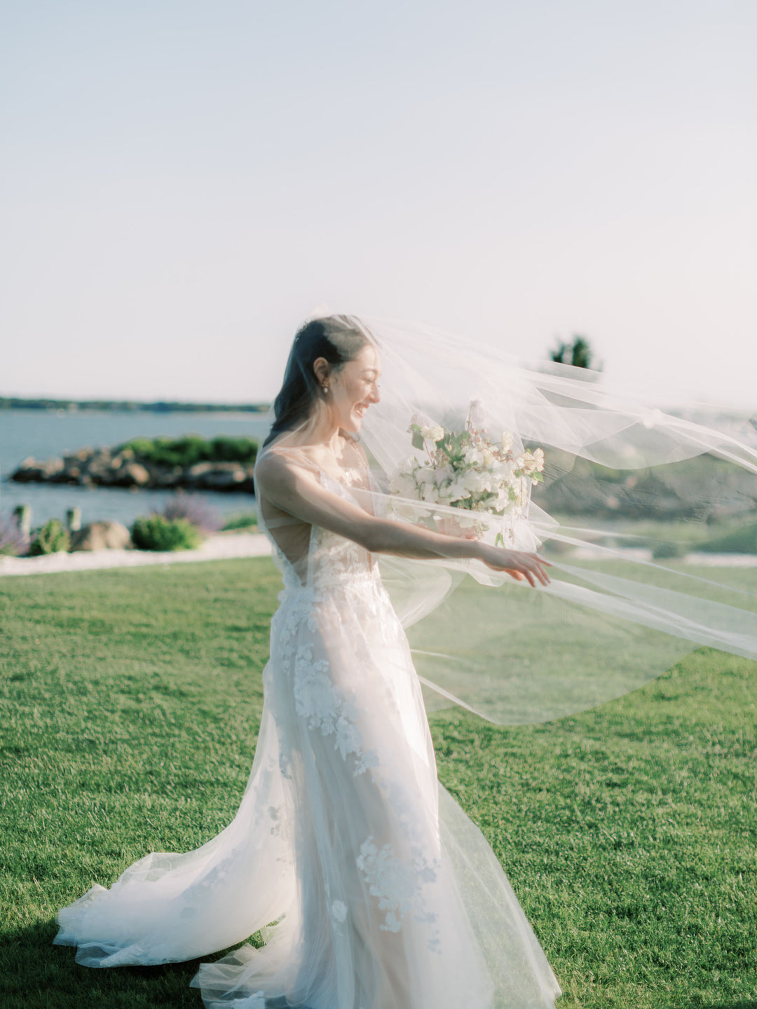 Bride with wedding veil in the wind.
