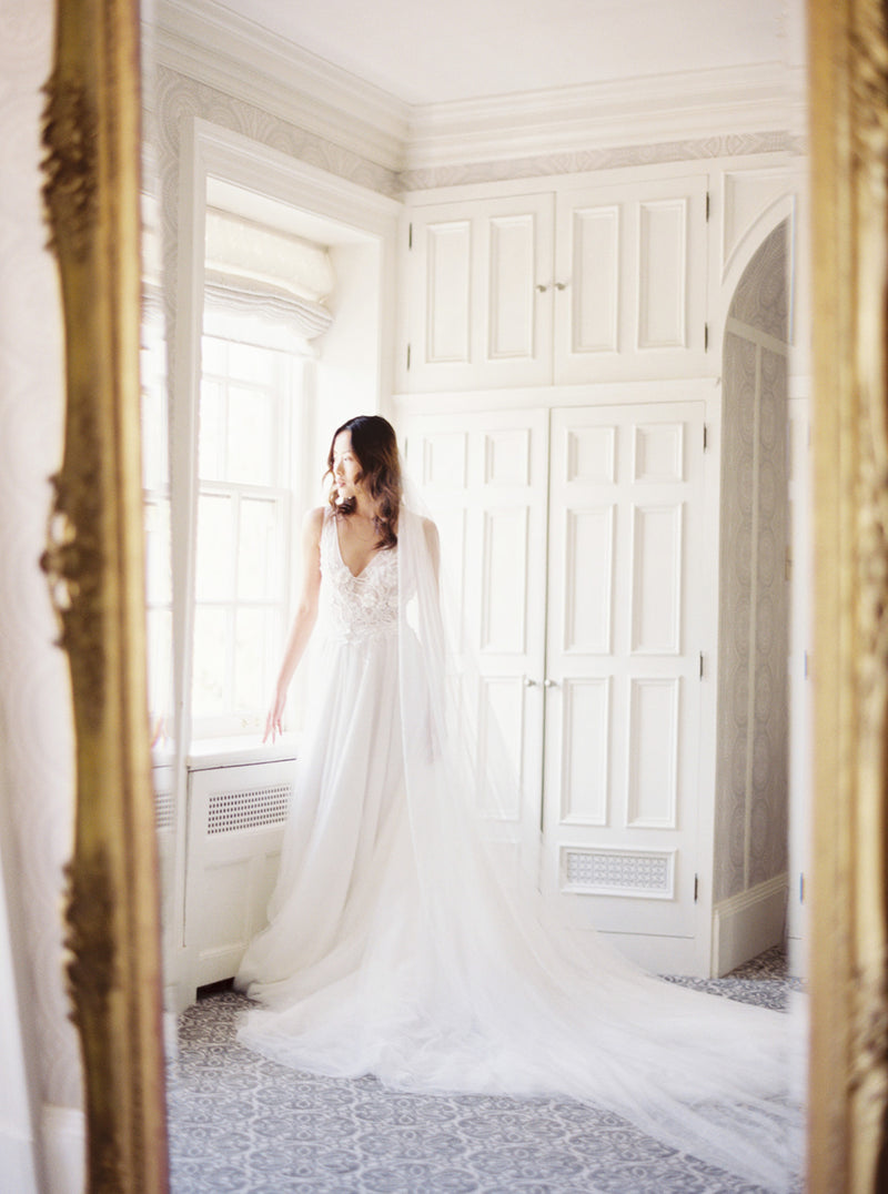Cathedral length wedding veil styled with lace wedding dress.