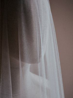 Close up image of the Monique silk wedding veil with blusher, showcasing the delicate soft texture of the French silk tulle. 