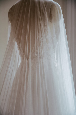 Back view of the Monique wedding veil, shown on a dress mannequin. 