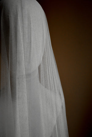 Detailed shot of the Monique silk wedding veil, showing the soft blusher draping over a headform.
