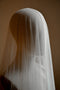 The Monique silk veil with blusher shown on a head mannequin. The silk softly clings.