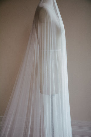 Side view of the Monique silk veil, showcasing the soft drape of the tulle and the long dramatic blusher.