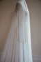 Side view of the Monique silk veil, showcasing the soft drape of the tulle and the long dramatic blusher.