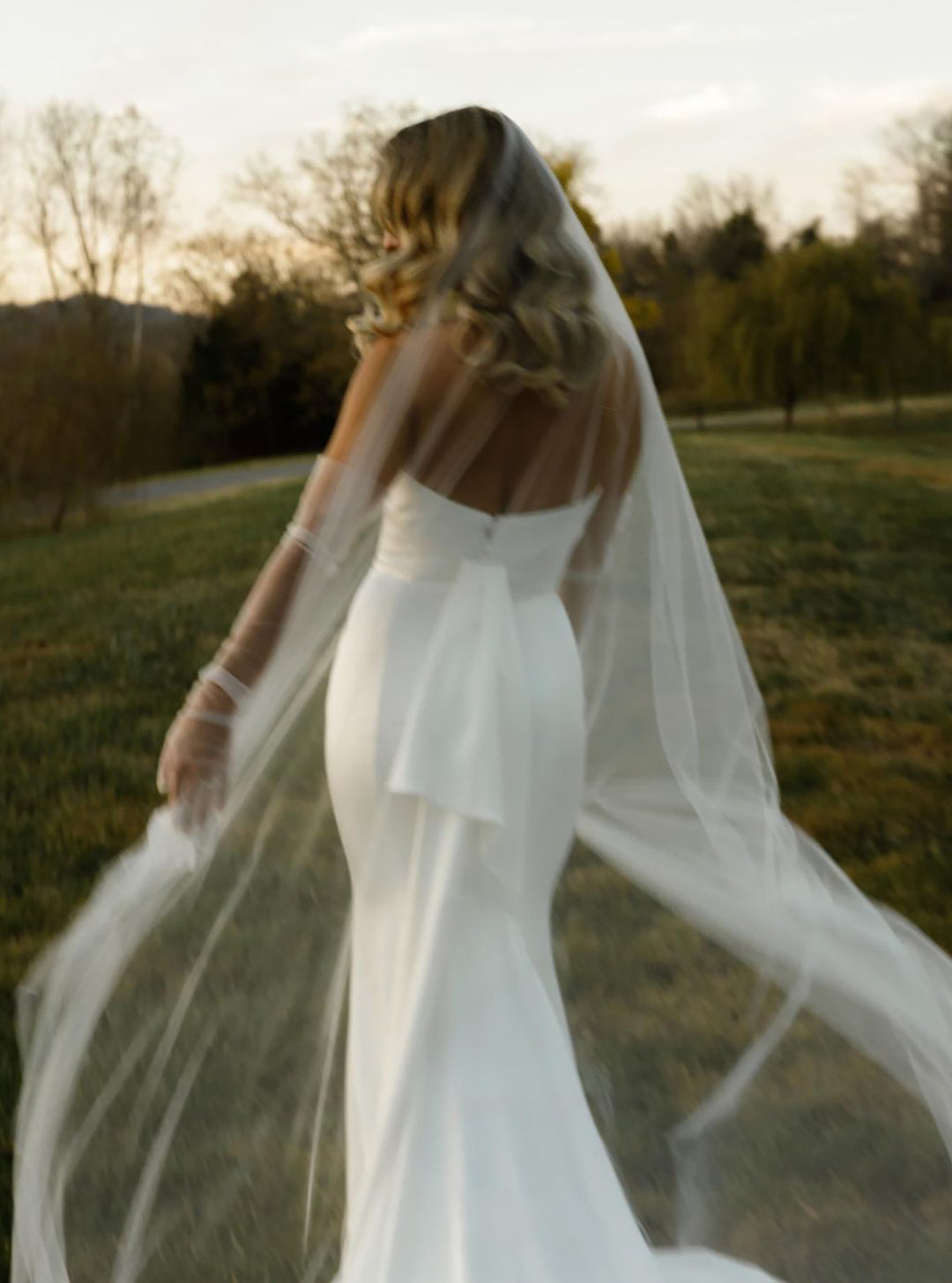 https://www.noononthemoon.com/cdn/shop/files/PAIGE-ultra-sheer-wedding-veil-2.jpg?v=1698212506&width=1080