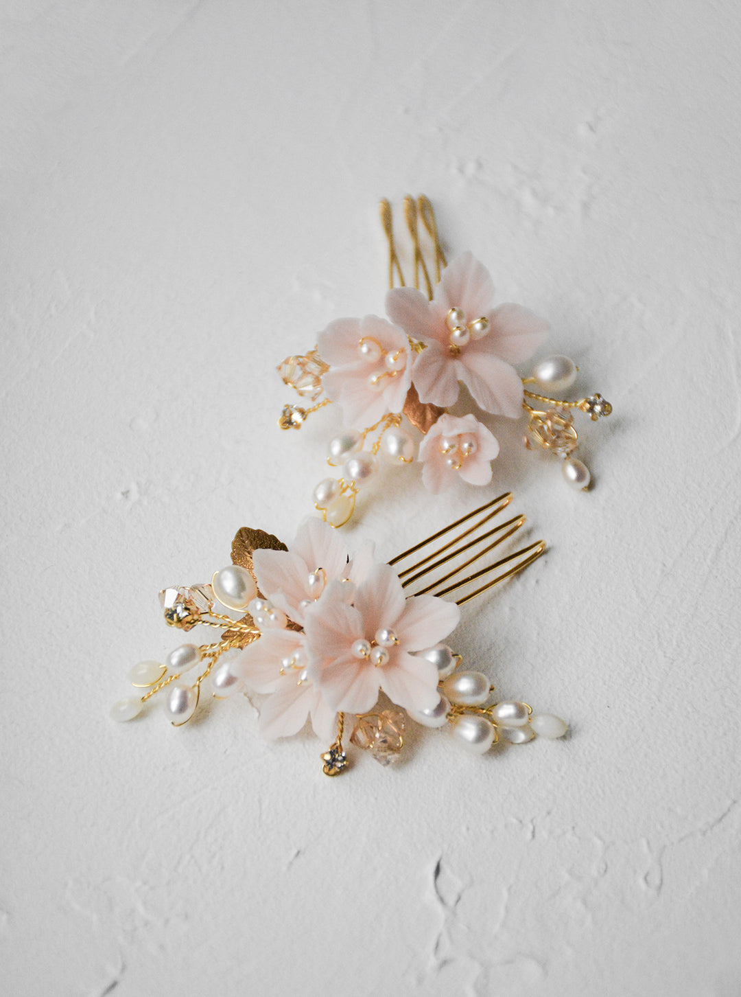 Blush bridal hair combs.