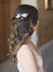 Blush bridal hair combs with long wedding hairstyle.