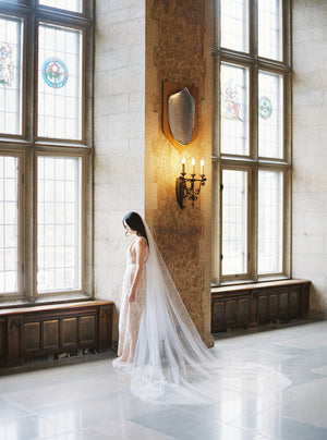 Long blusher wedding veil.