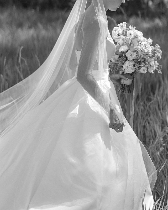 Profile shot highlighting the soft, flowing movement of the Talitha one-tier veil.