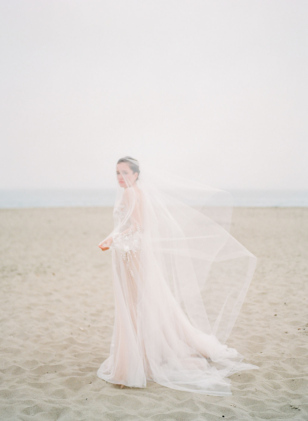 https://www.noononthemoon.com/cdn/shop/products/ADDISON-sheer-wedding-veil-with-long-blusher-8_1800x1800.jpg?v=1678643961