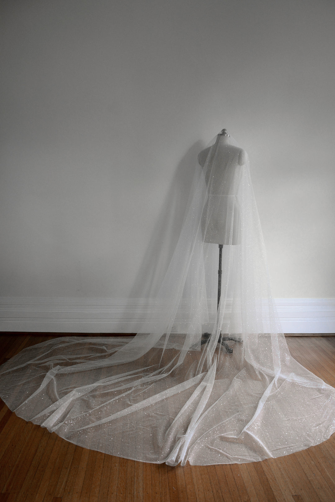 https://www.noononthemoon.com/cdn/shop/products/CAPELLA-sparkling-wedding-veil-with-blusher-5.jpg?v=1679348982&width=1080