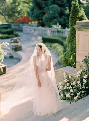 Ethereal bridal portrait at Graydon Hall, showing the Cassandra Veil's long blusher draped over the bride's face.  