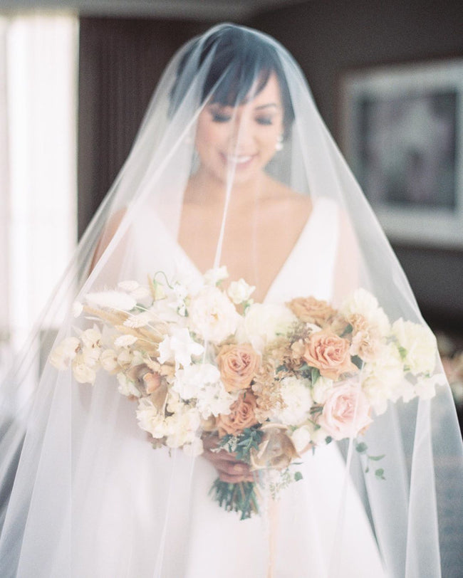 https://www.noononthemoon.com/cdn/shop/products/CASSANDRA-wedding-veil-with-long-blusher-16_1800x1800.jpg?v=1675367159