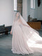 Bride turning gracefully while wearing the Grace Pure Silk Blusher Veil, highlighting the material's elegant movement.