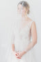 Sheer wedding veil with blusher.