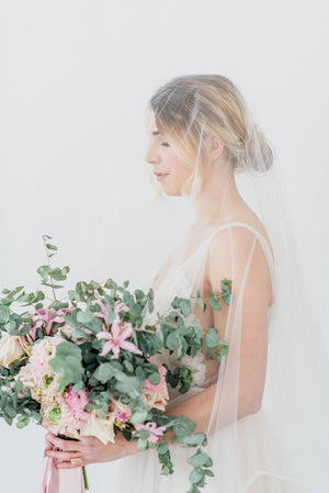 Sheer wedding veil with blusher.