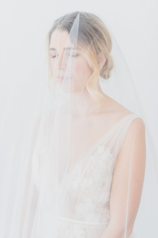 Sheer wedding veil with blusher.