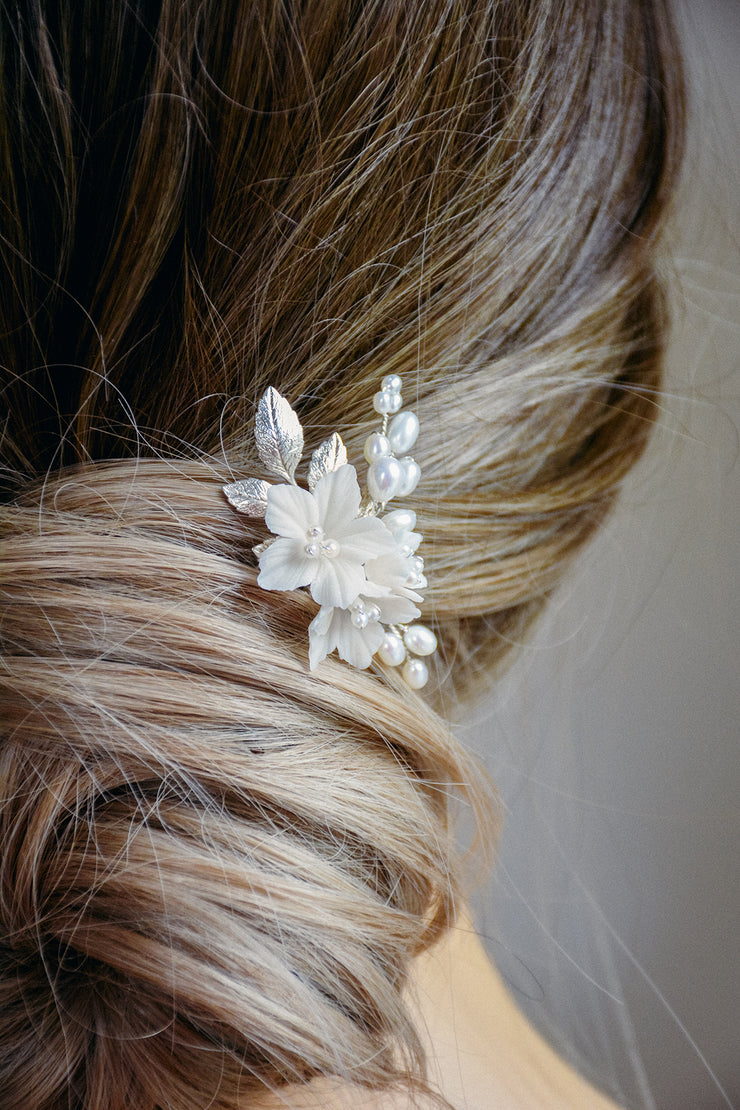 LILI | Floral Wedding Hair Pin styled in a bridal updo hairstyle.
