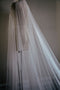 Side view of the OPERA pearl veil showing the drape of the tulle.