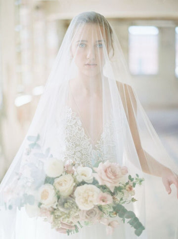 Bridal veil with long blusher.