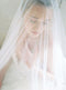 Bridal veil with long blusher.