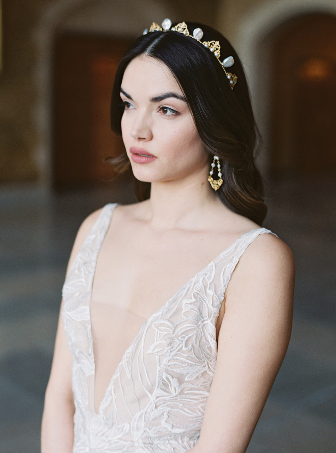 A dainty pearl bridal crown worn with hair down.