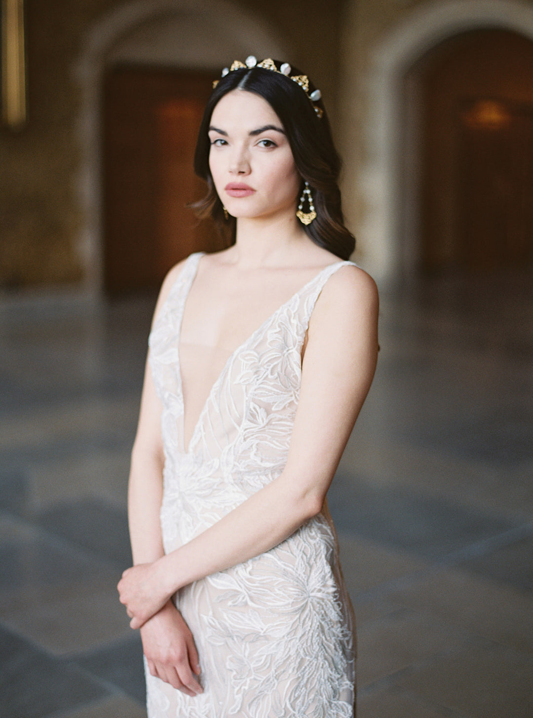 Delicate pearl tiara styled with chandelier earrings.