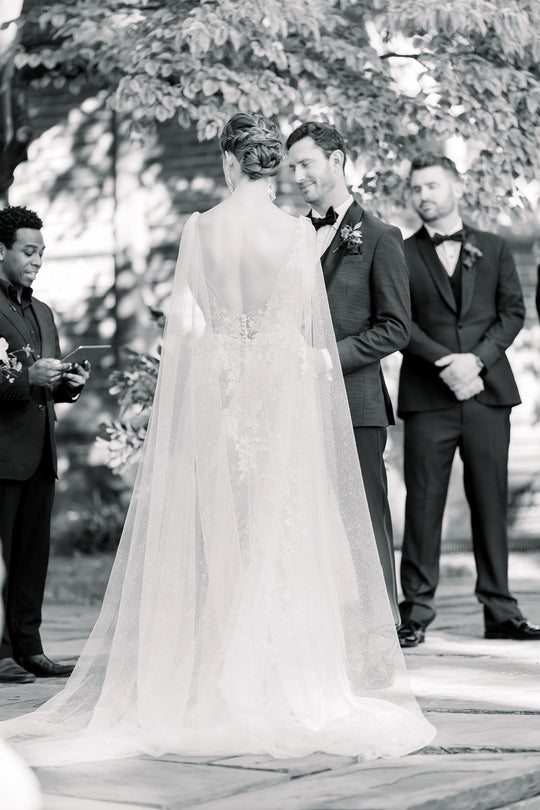 bride wearing bridal cape